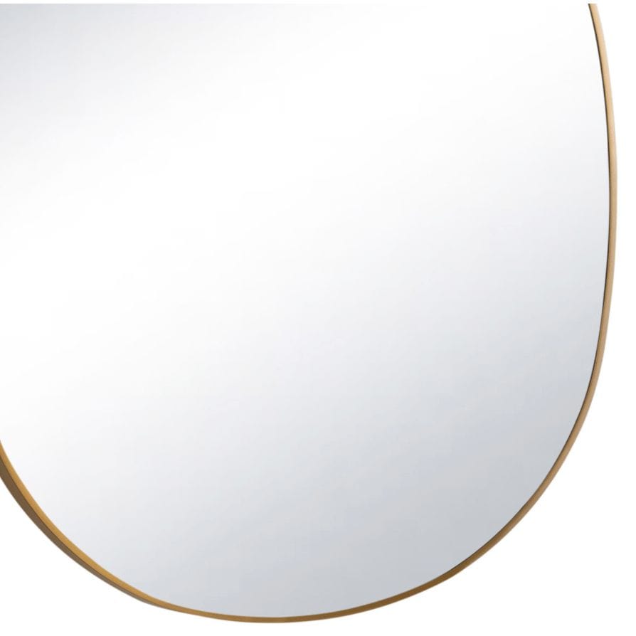 Mela Metal Mirror with a natural brass steel frame and unique organic silhouette.
