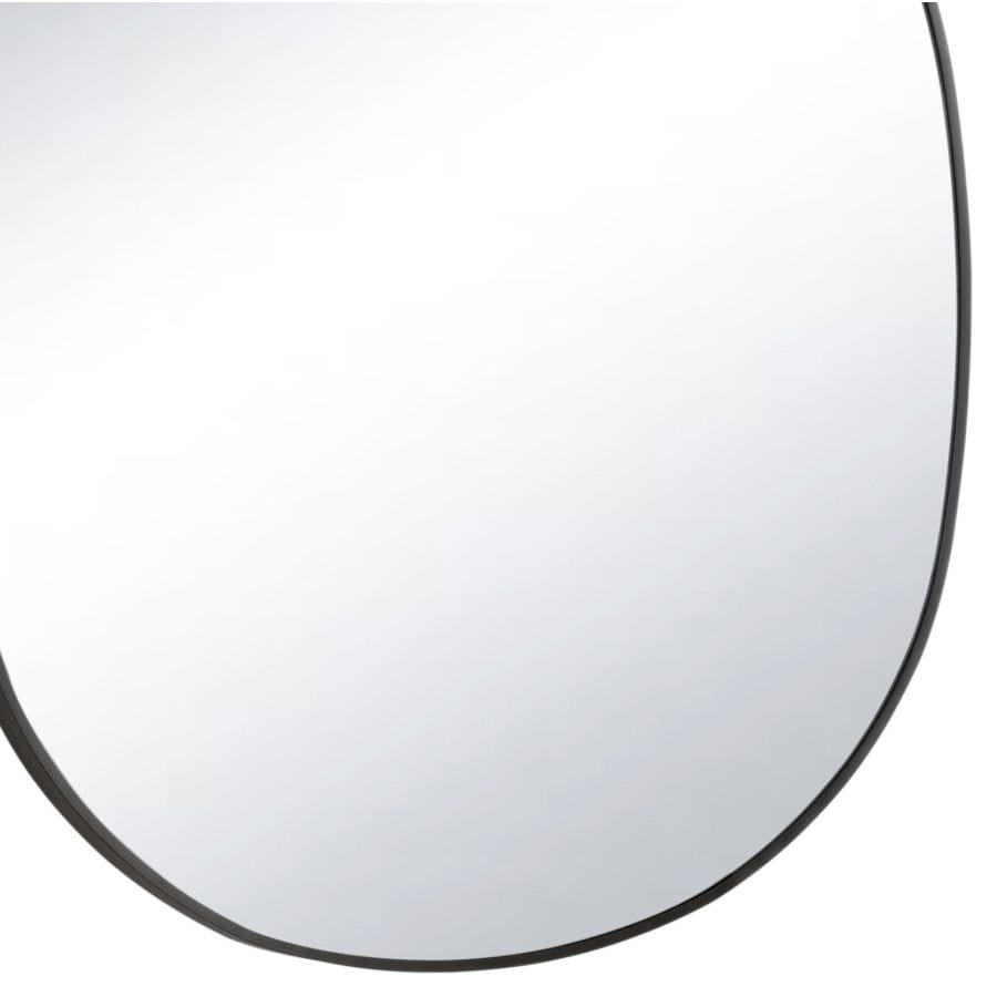 Mela Metal Mirror with a natural brass steel frame and unique organic silhouette.