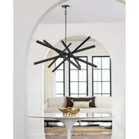 Two Milo Large Brass Decorative Bowls on a white tulip table in a modern living space.