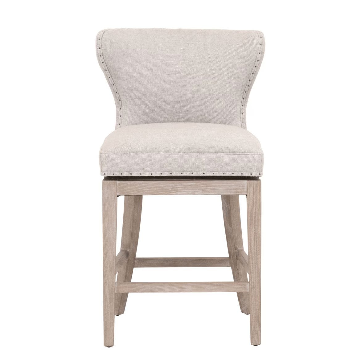 Milton Bisque French Linen swivel counter stool with transitional design, light wood legs, and nailhead trim.