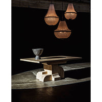 Three black steel Mist chandeliers with beaded glass shades illuminate a modern wood table.