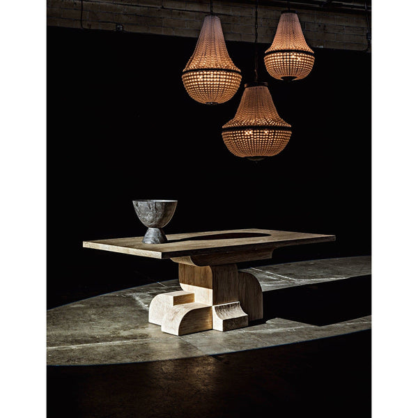 Three black steel Mist chandeliers with beaded glass shades illuminate a modern wood table.