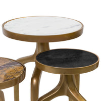 Set of three Modernist mixer tables with gold bases and round tops: white marble, black, and brown marble.