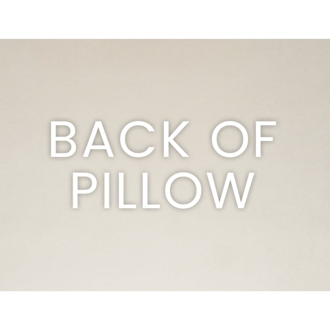 Modernist Oat Throw Pillow, back view, showing the seamless zippered cover and plush texture.