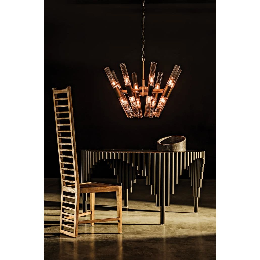 Moira Chandelier: Antique brass finish, industrial steel and glass, 8-bulb fixture over a dining table.