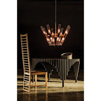 Moira Chandelier: Antique brass finish, industrial steel and glass, 8-bulb fixture over a dining table.
