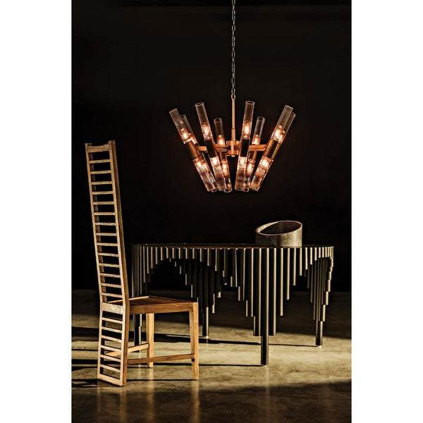 Moira Chandelier: Antique brass finish, industrial steel and glass, 8-bulb fixture over a dining table.