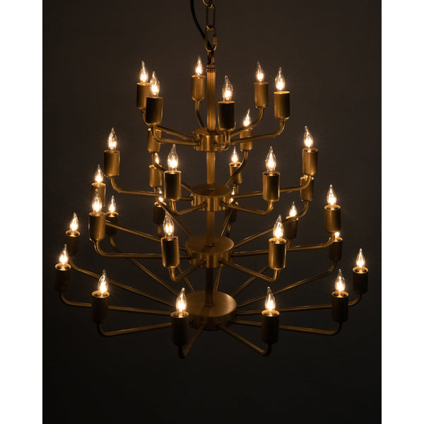 Montoro antique brass chandelier with four tiers of lit bulbs, a modern classic design.
