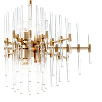 Large Montreal aged brass chandelier with linear design and varying length glass rods.