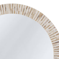 Round multitone bone tile mirror with slender, handcrafted striping.