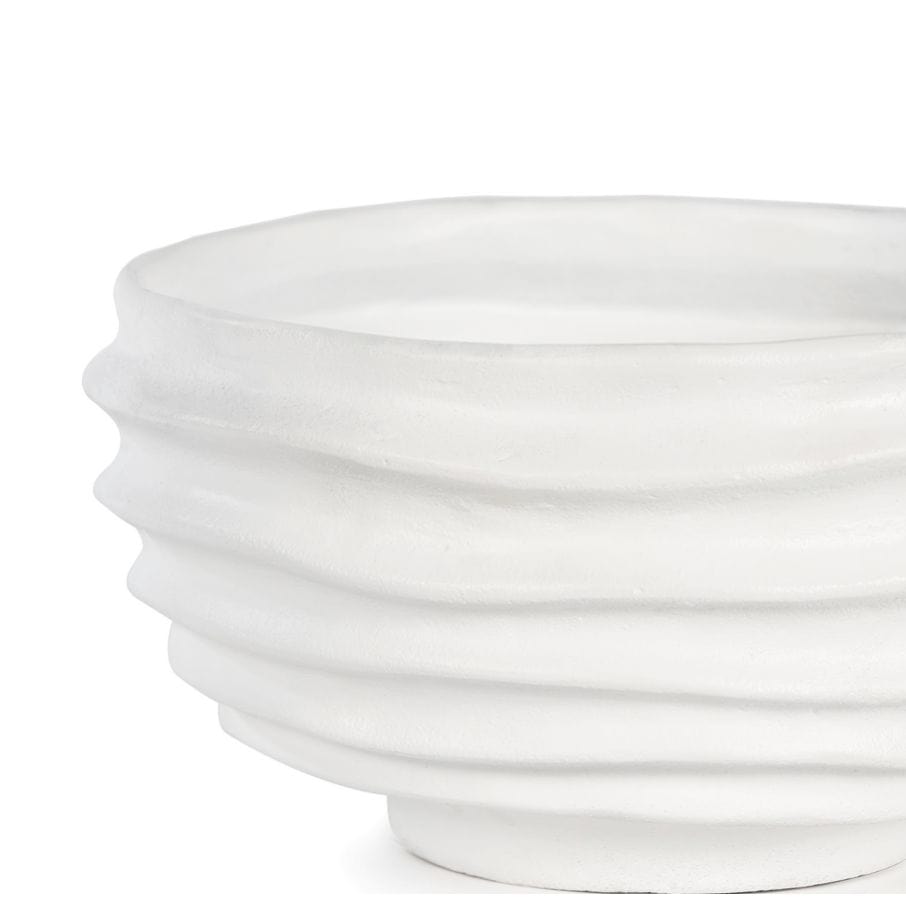 White sculpted metal Nabu bowl with irregular groove pattern and plaster-like finish.