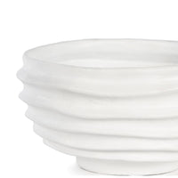 White sculpted metal Nabu bowl with irregular groove pattern and plaster-like finish.