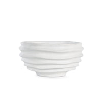 White sculpted metal Nabu bowl with irregular groove pattern and plaster-like finish.