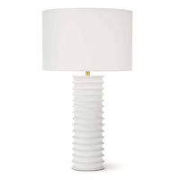 White Nabu metal column table lamp with accordion-like base and linen shade.