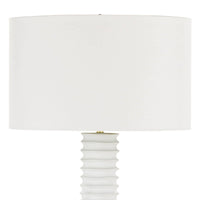White Nabu metal floor lamp with an accordion-like base and a large, simple white linen shade.
