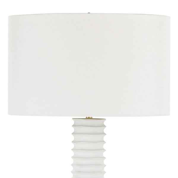 White Nabu metal floor lamp with an accordion-like base and a large, simple white linen shade.