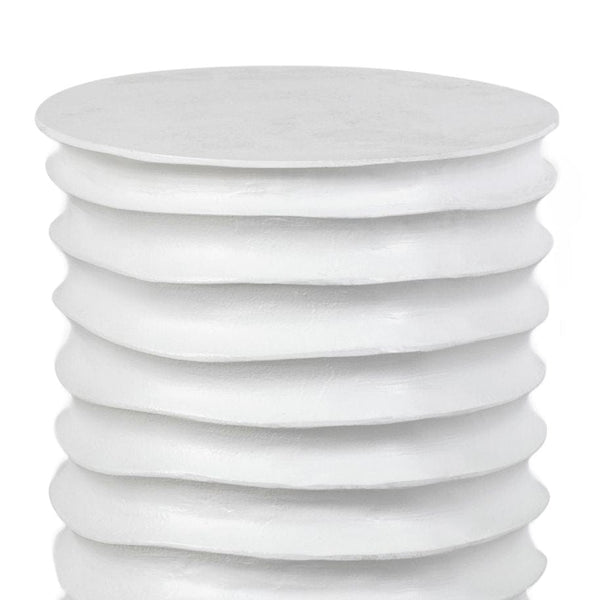 White Nabu Metal Table, drum-shaped aluminum with accordion-like texture and finger grooves.