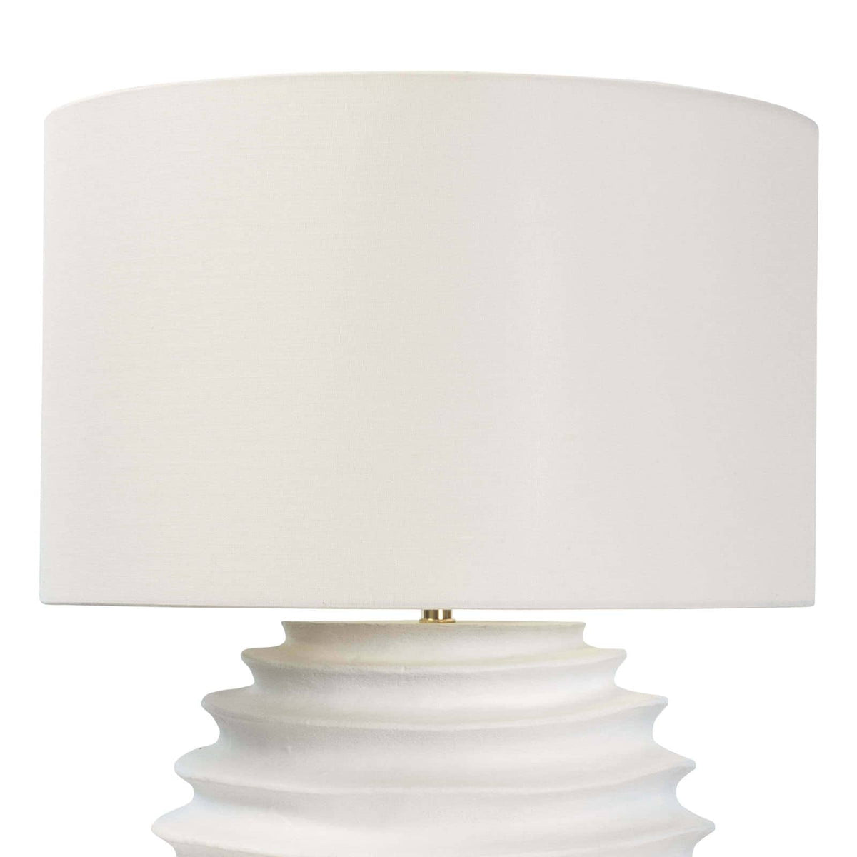 White Nabu metal table lamp with an accordion-like base and a simple linen shade.