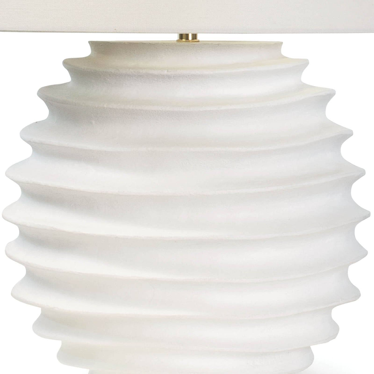 Nabu Metal Table Lamp with a tactile white accordion-like base and a simple linen shade.