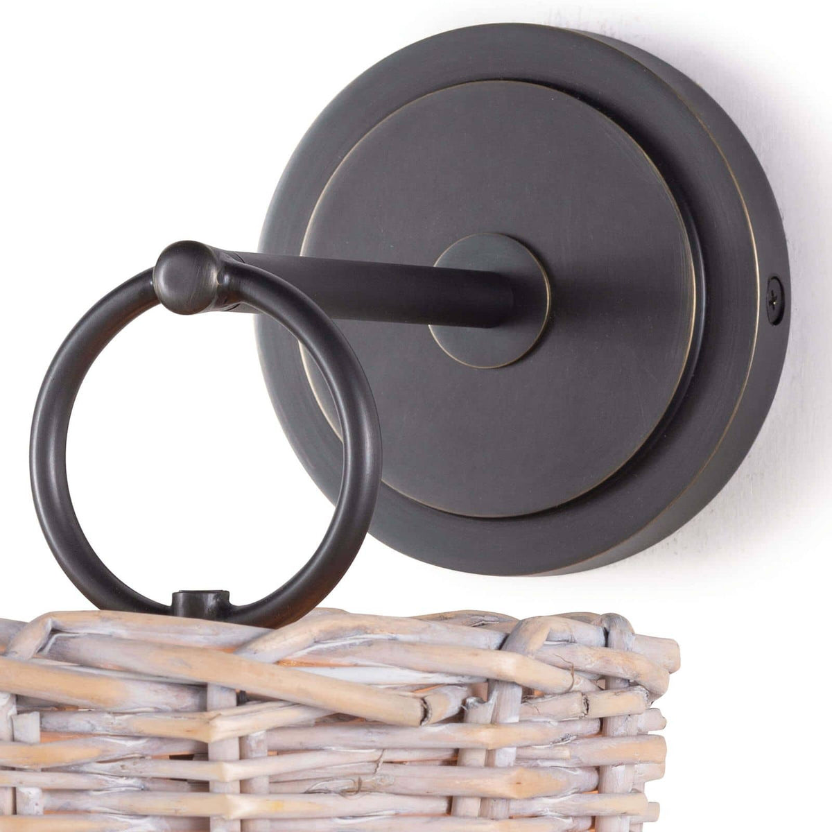 Nantucket sconce with an oil-rubbed bronze backplate and a handwoven rattan basket shade.