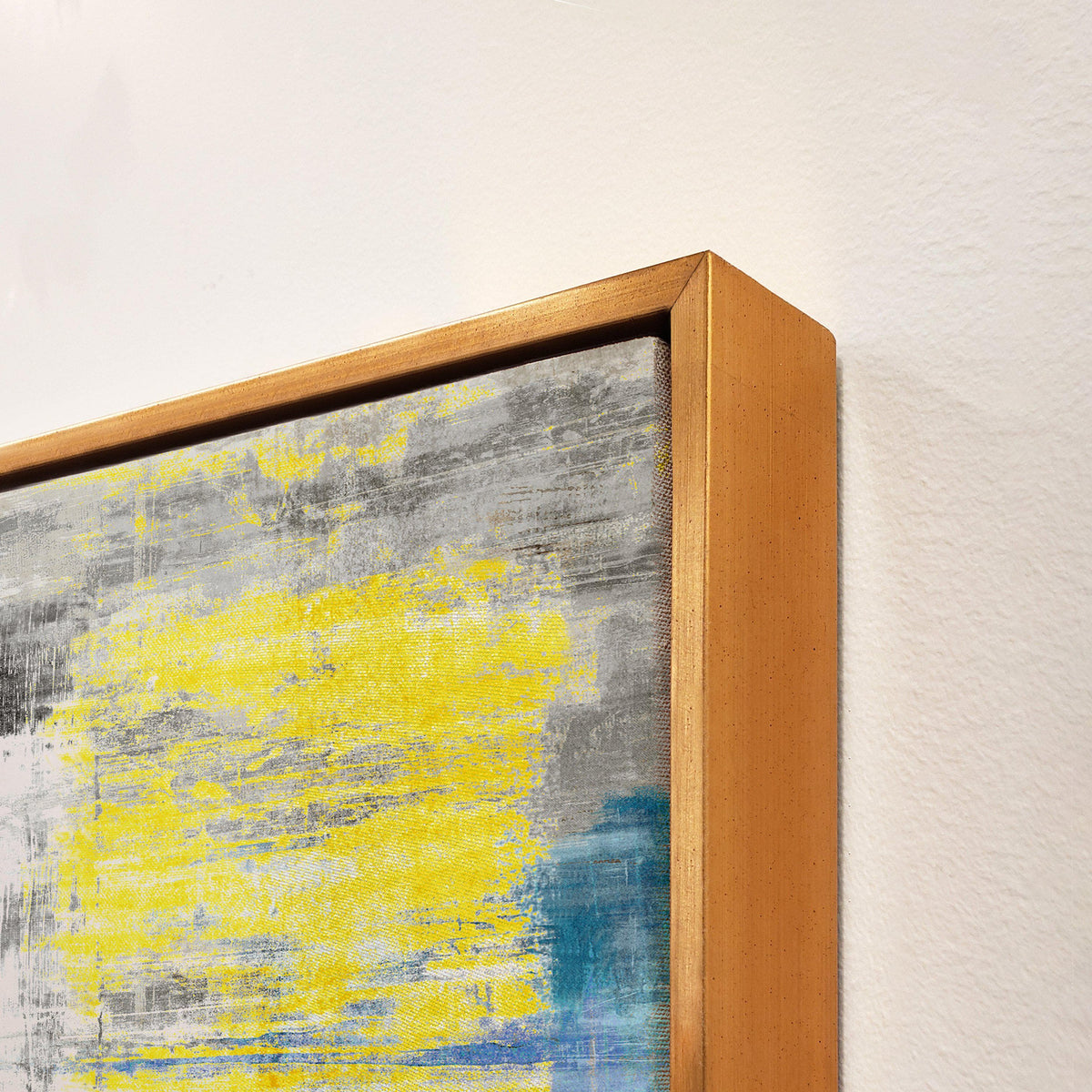 Abstract giclee canvas painting with yellow, gray, and blue brushstrokes in a gold floating frame.