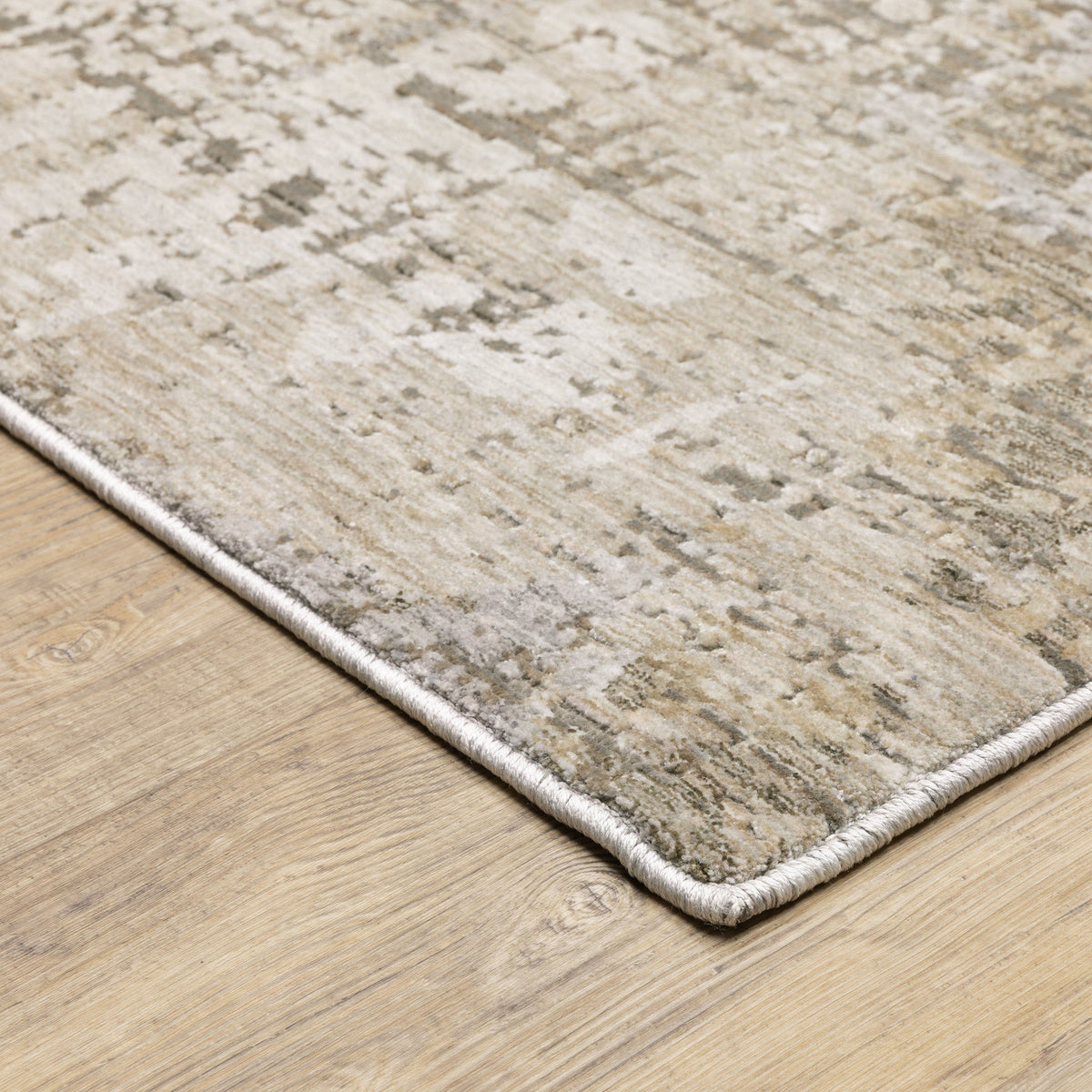 Nebulous Beige Abstract Contemporary Rug, a low-profile polyester rug with a modern abstract pattern in neutral shades.