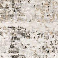 Close-up of a Nebulous contemporary rug with abstract beige, ivory, and black patterns on soft polyester.