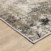 Nebulous Beige & Ivory Contemporary Rug with abstract patterns in charcoal, beige, and ivory on a wood floor.