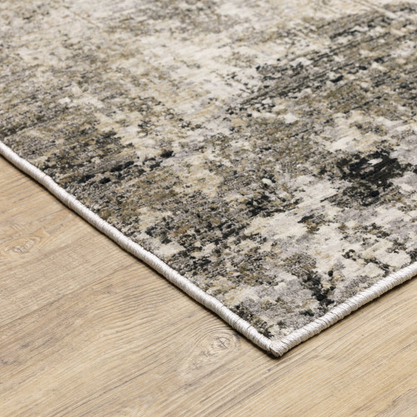 Nebulous Beige & Ivory Contemporary Rug with abstract patterns in charcoal, beige, and ivory on a wood floor.