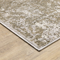 Contemporary beige, ivory & grey abstract polyester rug with a low-profile design on a wood floor.