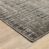 Nebulous Charcoal & Grey Casual Rug, hand-hooked polyester with modern abstract pattern on wood floor.