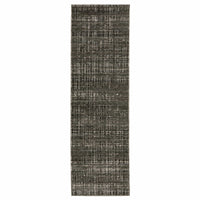 Long, rectangular charcoal and grey polyester rug with a modern abstract pattern.
