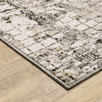Nebulous Grey, Ivory & Black Contemporary Rug with abstract patterns on a wood floor.