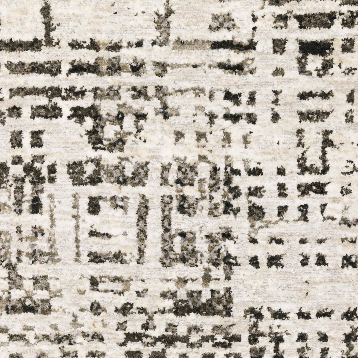 Abstract ivory and charcoal casual rug with a low-profile, textured polyester design.