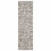 Nebulous Ivory Abstract Casual Rug, a long, narrow runner with charcoal and ivory abstract patterns.