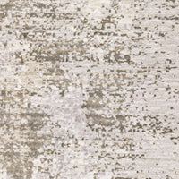 Close-up of a Nebulous Ivory & Beige Contemporary Rug with abstract patterns and soft polyester yarns.