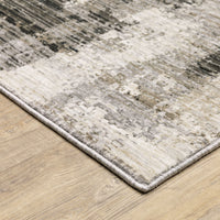 Contemporary ivory, grey, and black abstract polyester rug with a low-profile design on a wood floor.