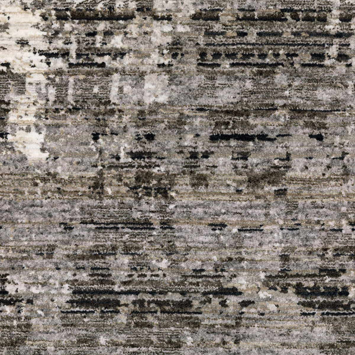 Contemporary polyester rug with abstract patterns in ivory, grey, and black.