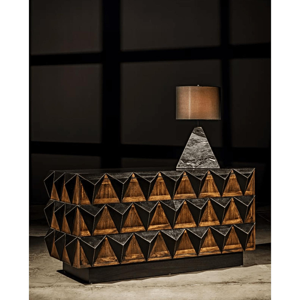 Nigel 6-drawer two-tone chest with bold high relief studs in hand-rubbed black and mahogany panels.