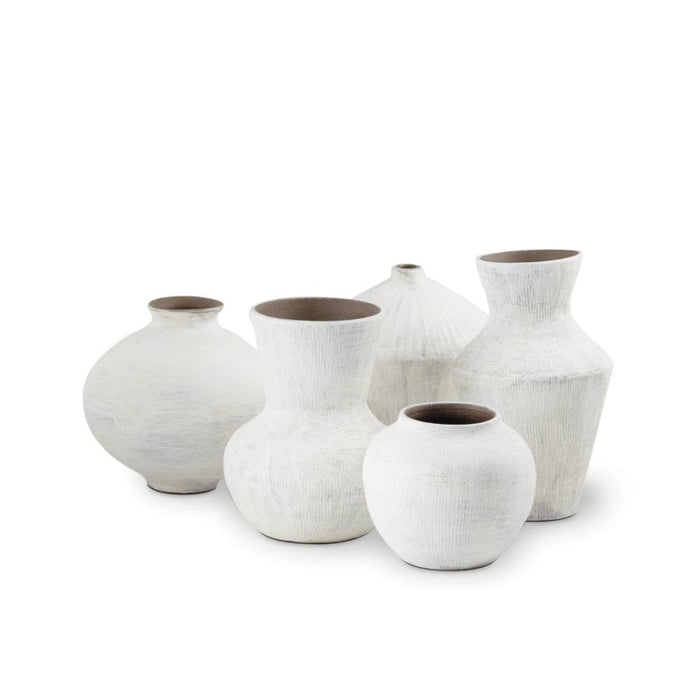 Noor Ceramic Vase Set: Five handmade organic white vases with unique textures and brown interiors.