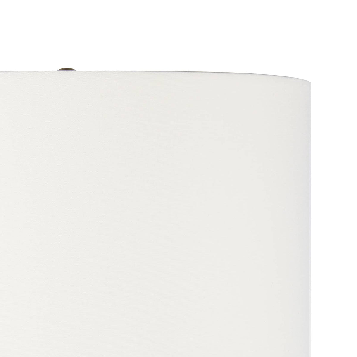 Close-up of a white linen drum shade with a natural brass finial on a Nova Wood Table Lamp.