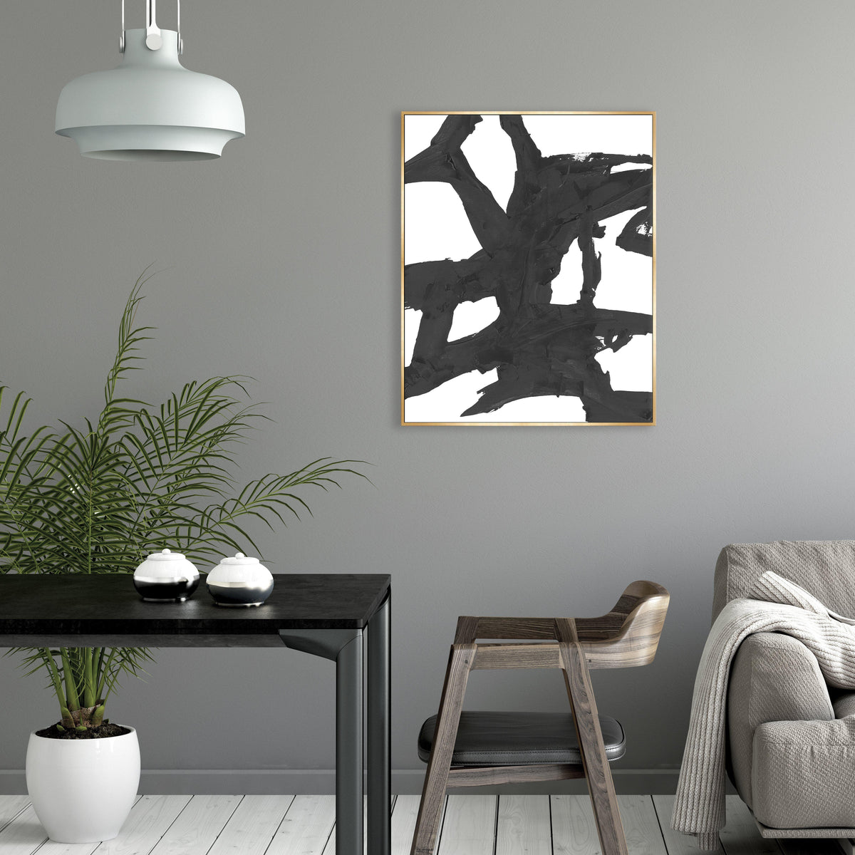 Obsidian III Giclee Canvas Painting: Abstract black brushstrokes on white, framed in gold, in a modern interior.