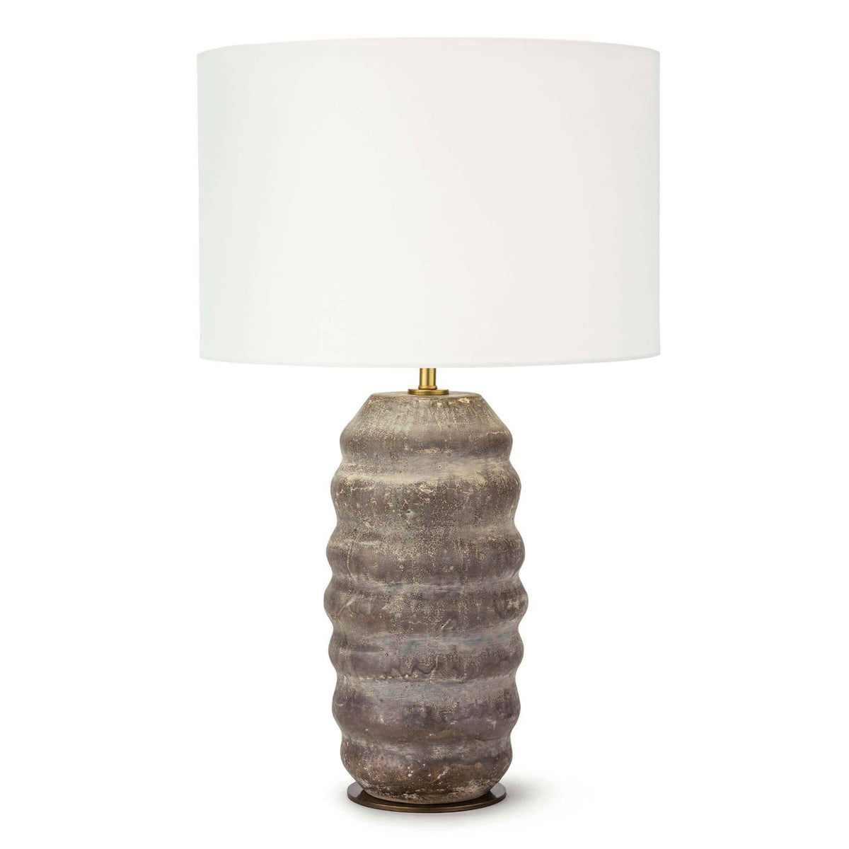 Ola ceramic table lamp with an organic, wavy earthenware base in earthen brown and tan, topped with a natural linen drum shade.