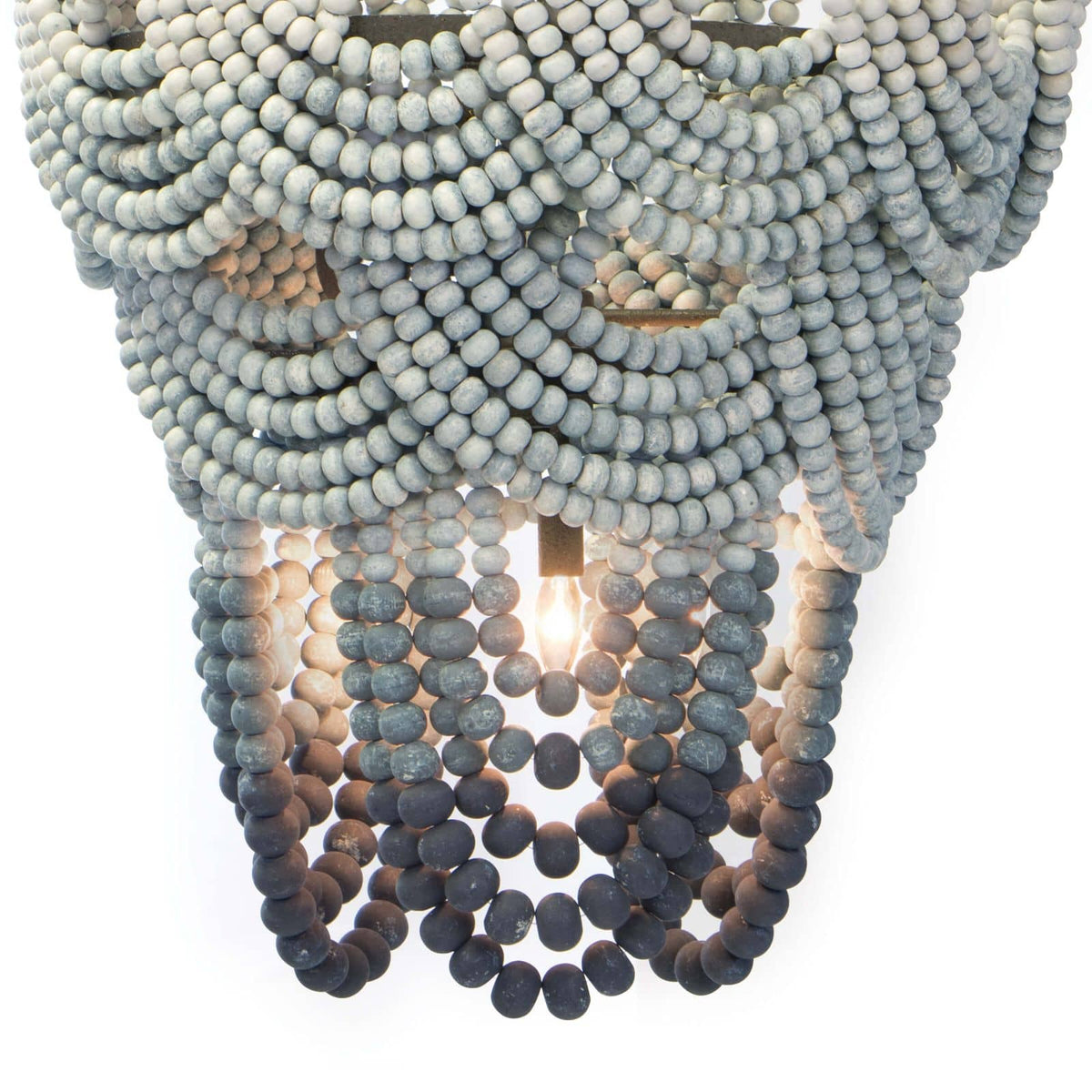 Ombre wood bead chandelier with blue gradient layers, jute-wrapped frame, and exposed candelabra bulbs.