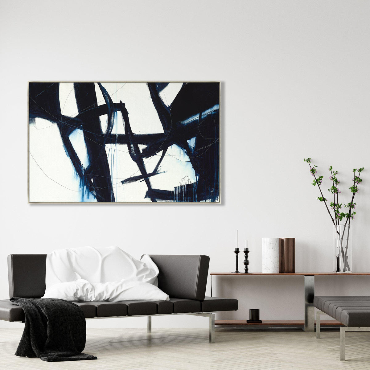 Abstract Omission Fate II giclee canvas painting with bold navy strokes on white, framed in a modern living room.