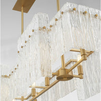Orinder 8-Light Aged Brass Linear Chandelier with hand-pressed textured and clear glass panels.