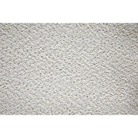 Close-up of off-white Boucle fabric with a textured, looped surface.
