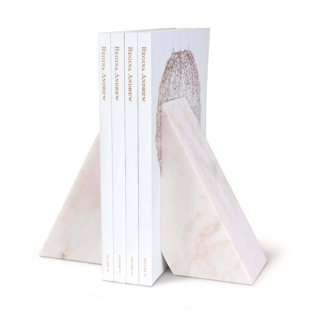 White marble Othello bookends with a sleek, mod design, holding four books.