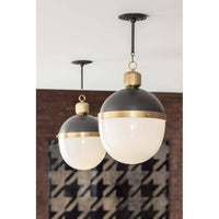Two Otis large blackened natural brass pendants with translucent white milk glass globes.