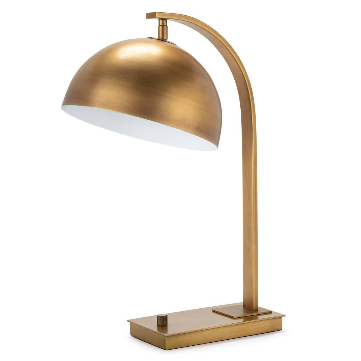 Otto Desk Lamp in natural brass with a curved neck, dome shade, and simple base.